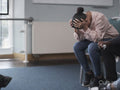 Woman crying in group therapy session