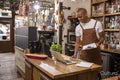 Cafe owner using laptop at counter