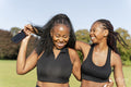 Young female friends walking in park after exercising