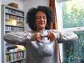 Woman lifting kettlebell at home
