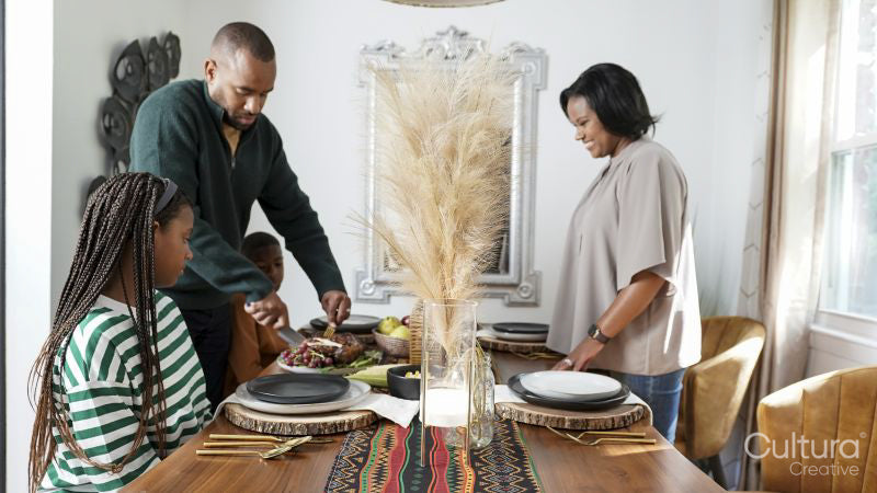 Family with children having Kwanzaa meal