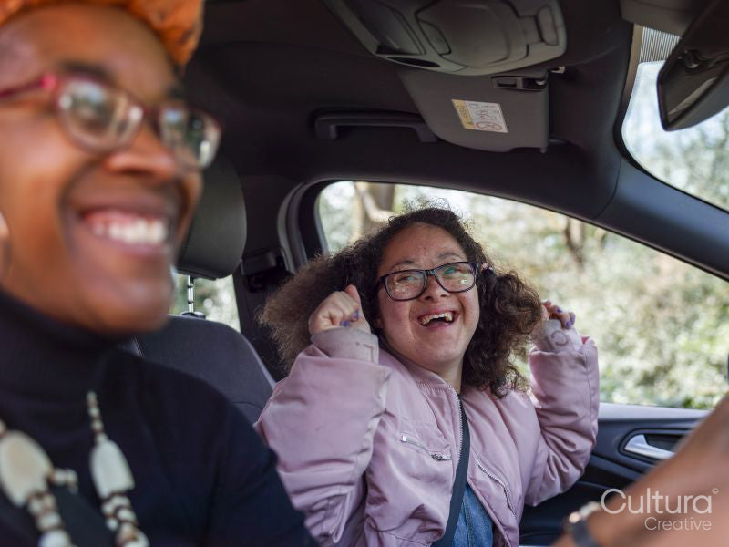 Woman and girl in car