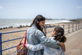 Mother and daughter hugging on promenade