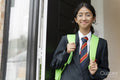 Schoolgirl leaving home for school