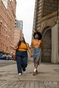 Two young women in street
