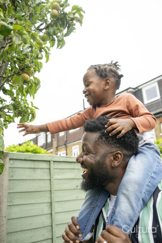 Father giving daughter piggyback ride