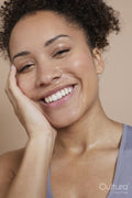 Close-up of smiling athletic woman with sweat of face