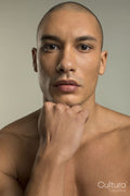 Studio portrait of serious shirtless man