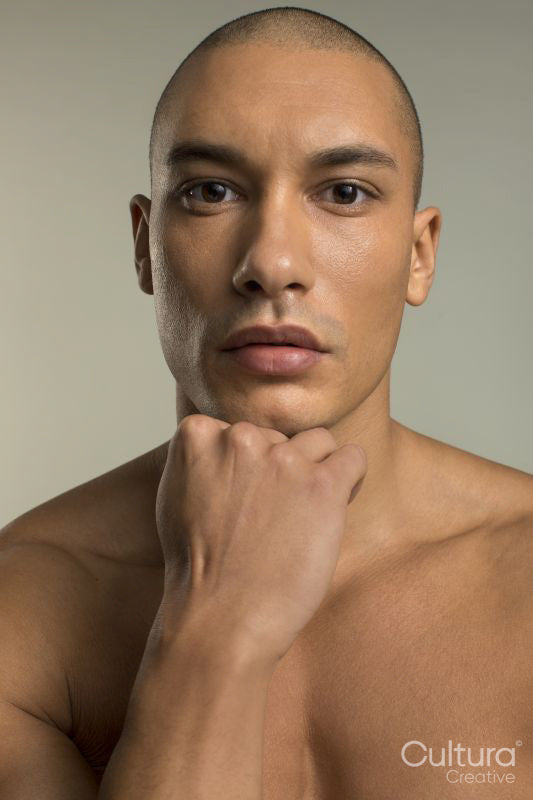 Studio portrait of serious shirtless man