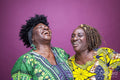 Studio shot of mature sisters laughing