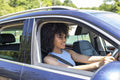 Young woman driving car