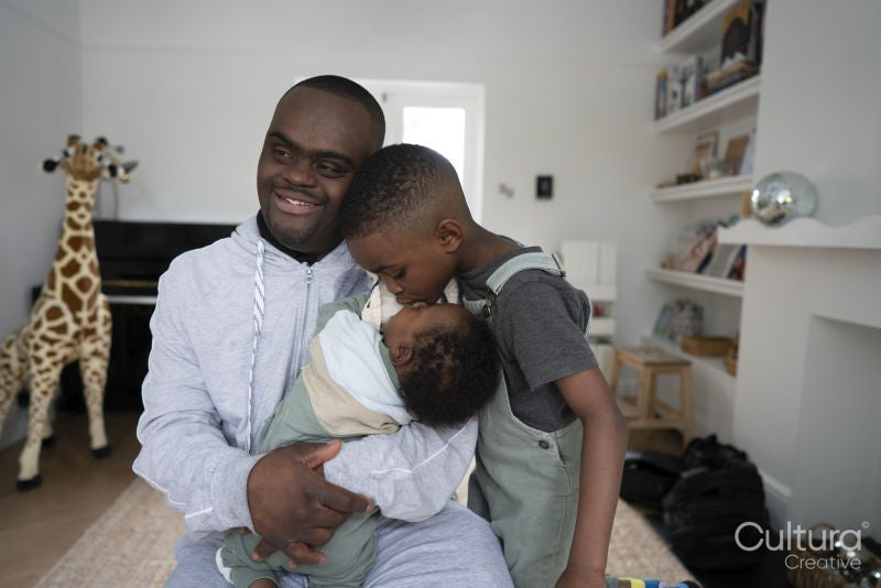 Man with Down syndrome with boys