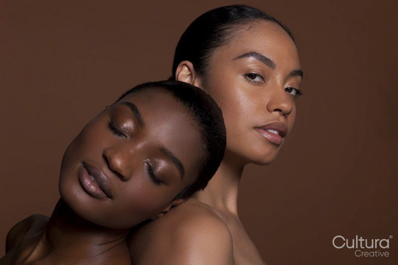Portrait of young women against brown background