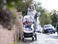 Woman pushing baby in stroller