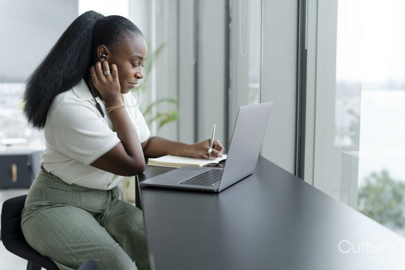 Businesswoman with laptop working in modern office