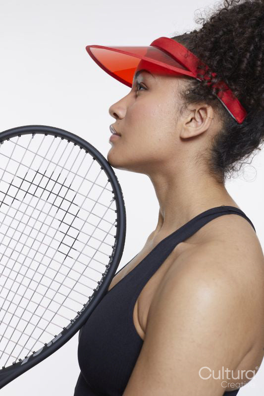 Profile of woman with tennis rocket and red sunvisor
