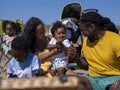Family with children relaxing on beach