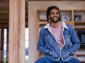 Portrait of young man sitting in lobby