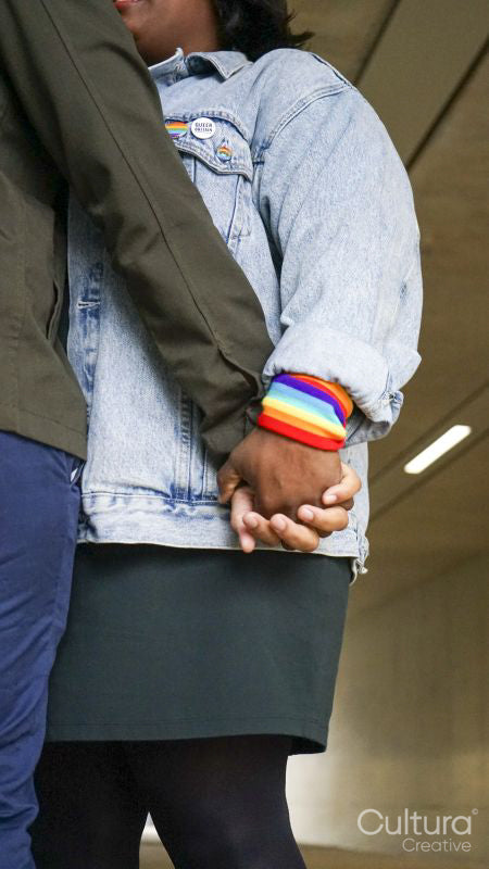 Two women holding hands, low angle view