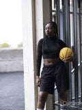 Young woman holding basketball outdoors