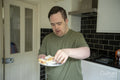 Man preparing breakfast in kitchen