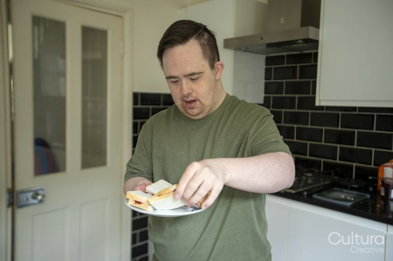 Man preparing breakfast in kitchen