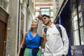 United Kingdom, London, Tourist couple looking at buildings