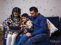 Father and children using digital tablet