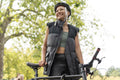 Smiling woman wearing bike helmet in park
