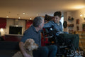 Father and disabled son embracing with dog