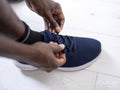 Close-up of hands tying sport shoe