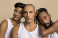 Studio portrait of men in white tank tops