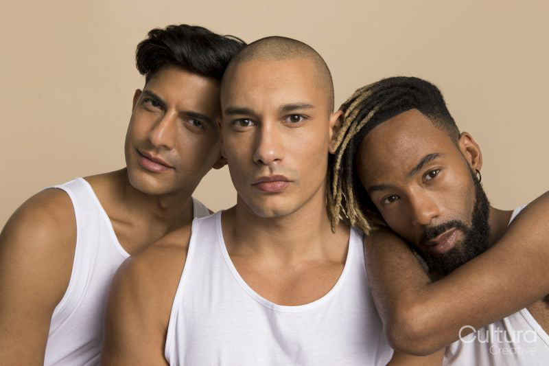 Studio portrait of men in white tank tops