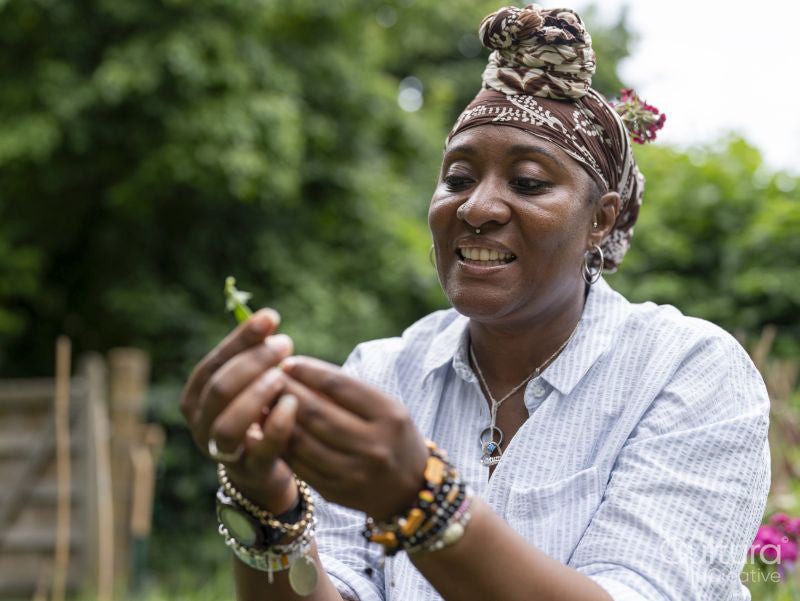 Woman holding produce from garden