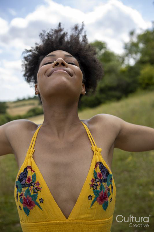 Young woman relaxing in meadow