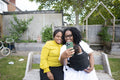 Grandmother with adult daughter and baby grandson taking selfie