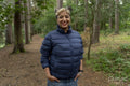 Portrait of smiling woman hiking in forest