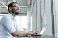 Businessman with laptop working in modern office