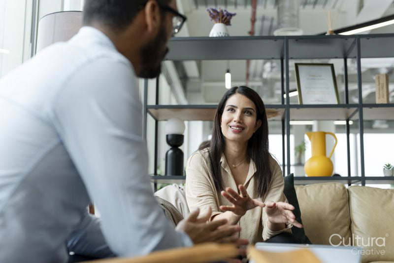 Business people having meeting in office lobby