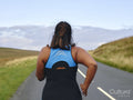 Female runner on country road
