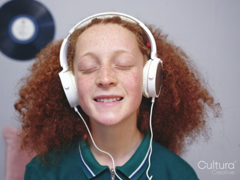 Girl listening to music on headphones