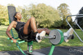 Young woman exercising in outdoor gym