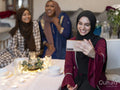 Smiling women taking selfie during Ramadan at home