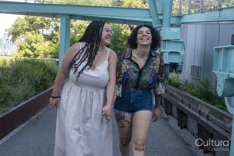 couple holding hands and laughing