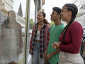Friends looking at window display