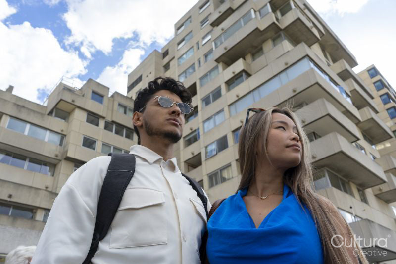 Young couple in front of apartment building