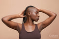Profile portrait of beautiful woman with mohawk hair