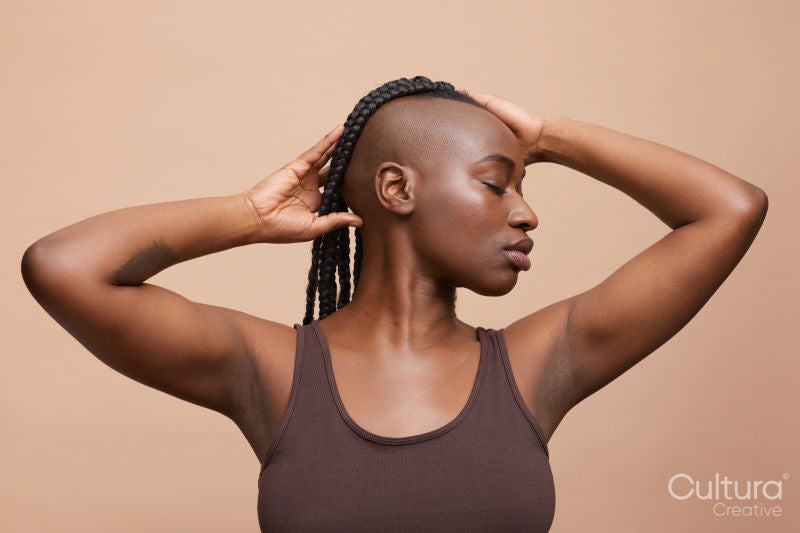 Profile portrait of beautiful woman with mohawk hair