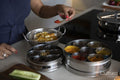 Close-up of woman cooking in kitchen