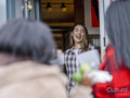 Women greeting at door while visiting friend in house